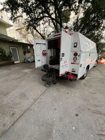 Magnet Plumbing service vehicle on-site for Grease Trap Cleaning in Hudson Bayou